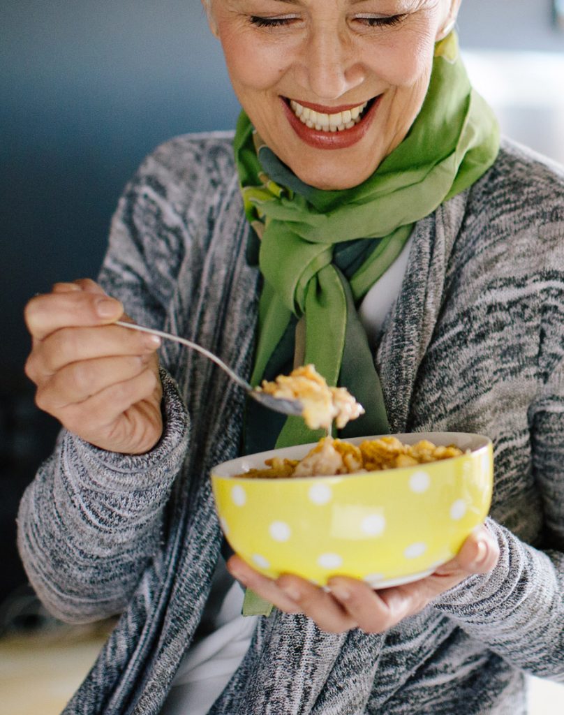 Older woman eating a healthy bowl